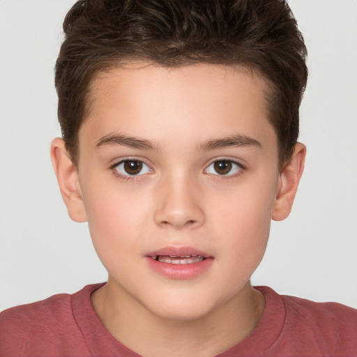 Joyful white child male with short  brown hair and brown eyes