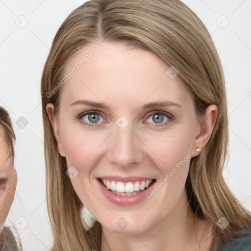 Joyful white young-adult female with long  brown hair and blue eyes