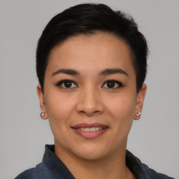 Joyful asian young-adult female with short  black hair and brown eyes