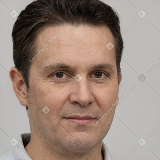 Joyful white adult male with short  brown hair and brown eyes