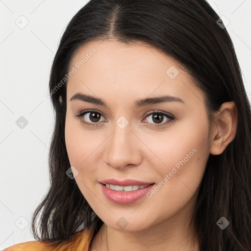 Joyful white young-adult female with long  brown hair and brown eyes