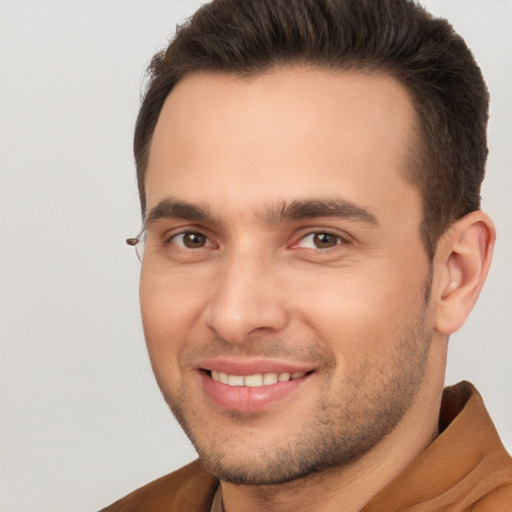 Joyful white young-adult male with short  brown hair and brown eyes