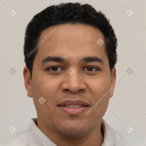 Joyful latino young-adult male with short  brown hair and brown eyes