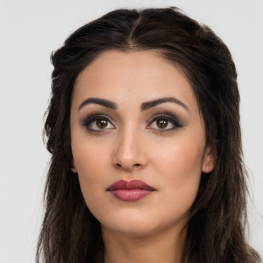 Neutral latino young-adult female with long  brown hair and brown eyes