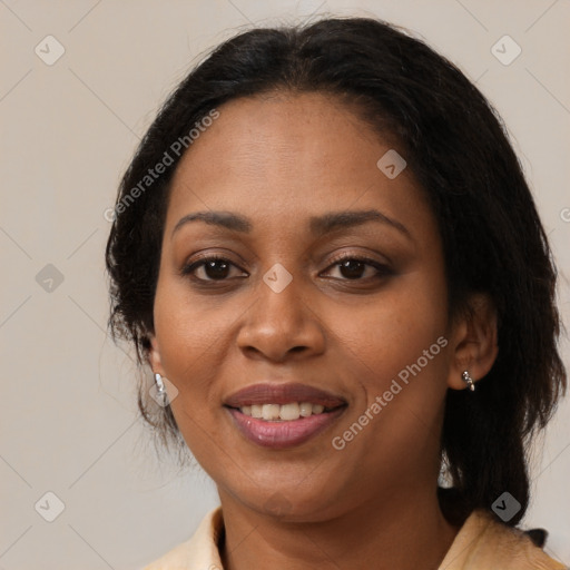 Joyful black adult female with medium  brown hair and brown eyes