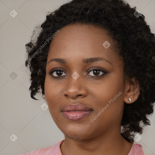 Joyful black young-adult female with medium  black hair and brown eyes