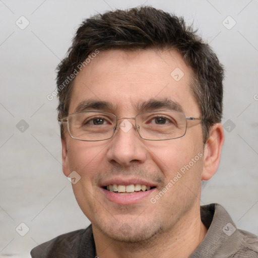 Joyful white adult male with short  brown hair and grey eyes