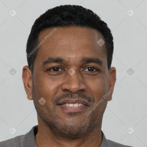 Neutral latino adult male with short  black hair and brown eyes