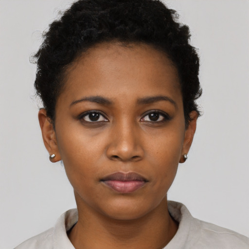 Neutral black young-adult female with short  black hair and brown eyes