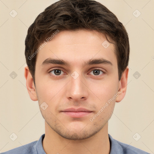 Neutral white young-adult male with short  brown hair and brown eyes