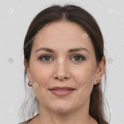 Joyful white adult female with medium  brown hair and grey eyes