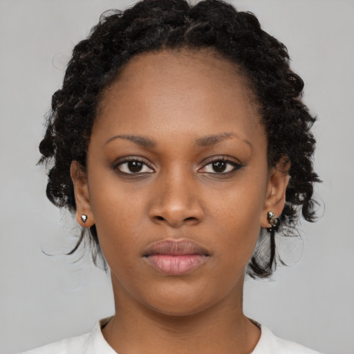 Neutral black young-adult female with medium  black hair and brown eyes