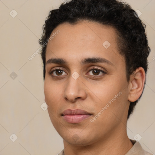 Joyful latino young-adult male with short  brown hair and brown eyes