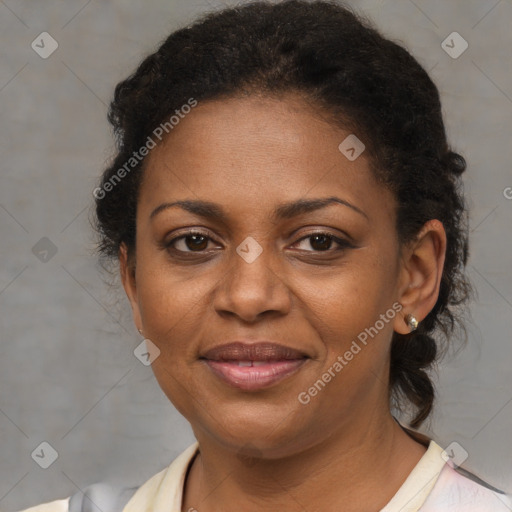 Joyful black adult female with short  brown hair and brown eyes