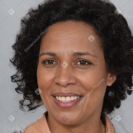 Joyful black adult female with medium  brown hair and brown eyes