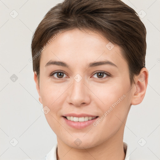 Joyful white young-adult female with short  brown hair and brown eyes