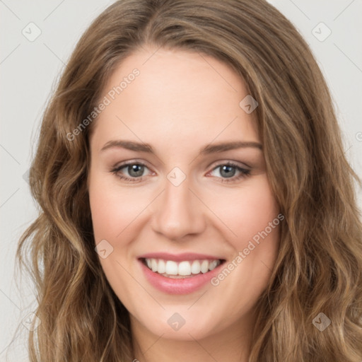 Joyful white young-adult female with long  brown hair and green eyes