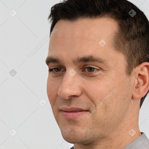 Joyful white adult male with short  brown hair and brown eyes