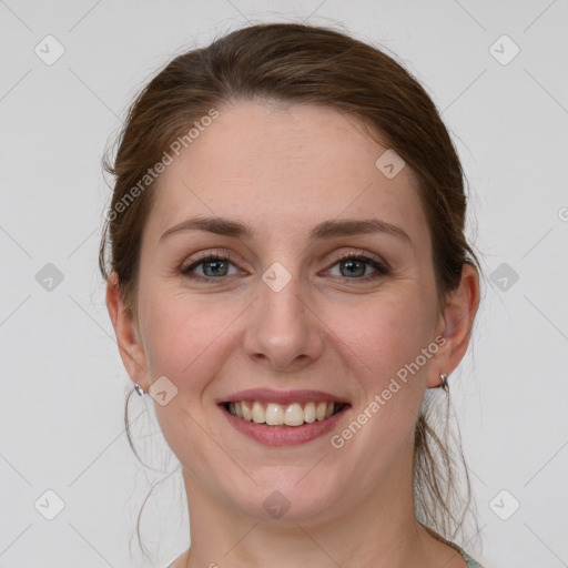 Joyful white young-adult female with medium  brown hair and grey eyes