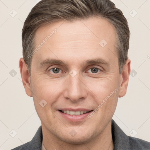 Joyful white adult male with short  brown hair and brown eyes