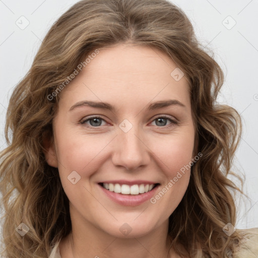 Joyful white young-adult female with long  brown hair and green eyes