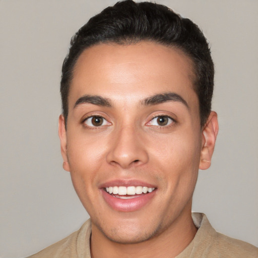 Joyful white young-adult male with short  black hair and brown eyes