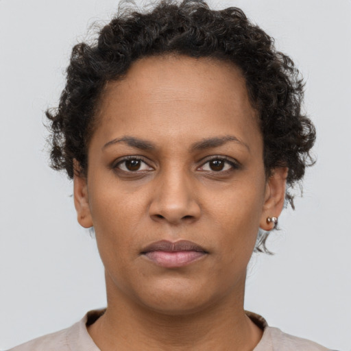Neutral black young-adult female with short  brown hair and brown eyes