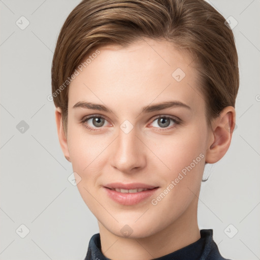 Joyful white young-adult female with short  brown hair and grey eyes