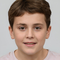 Joyful white child male with short  brown hair and brown eyes