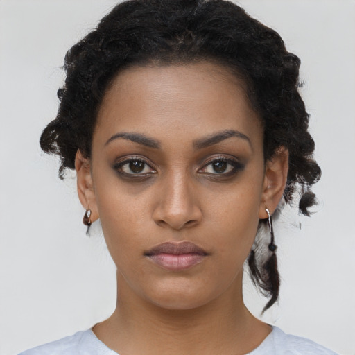 Neutral black young-adult female with short  black hair and brown eyes