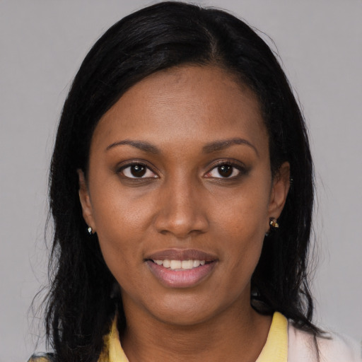 Joyful latino young-adult female with medium  black hair and brown eyes