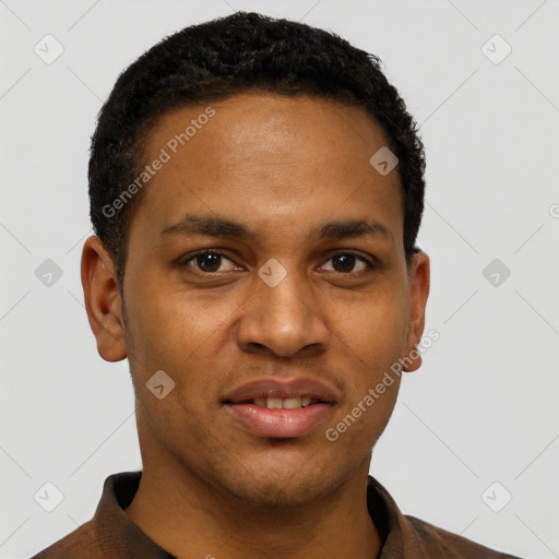 Joyful black young-adult male with short  black hair and brown eyes