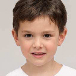 Joyful white child male with short  brown hair and brown eyes