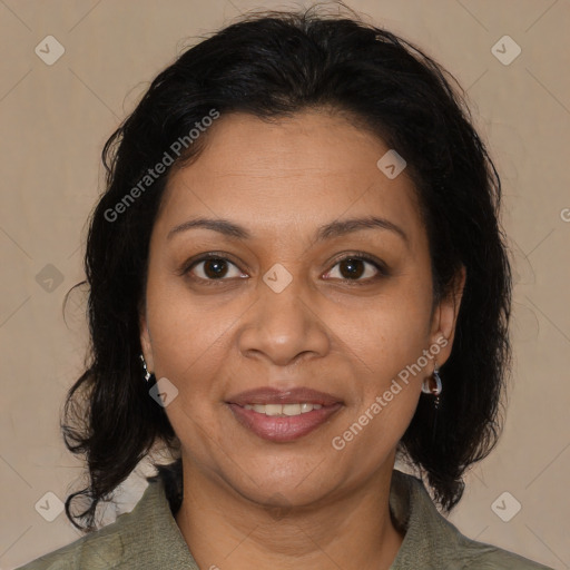 Joyful latino adult female with medium  brown hair and brown eyes