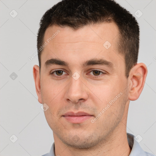 Neutral white young-adult male with short  brown hair and brown eyes