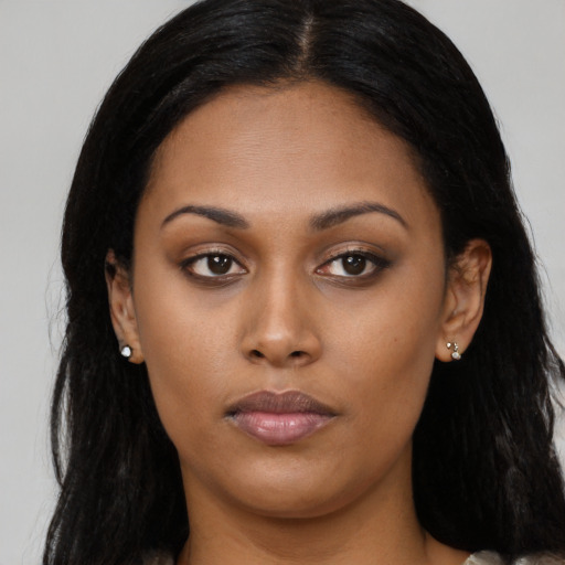 Neutral latino young-adult female with long  brown hair and brown eyes