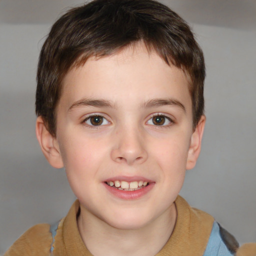 Joyful white child male with short  brown hair and brown eyes