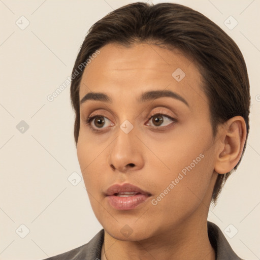 Neutral white young-adult female with short  brown hair and brown eyes