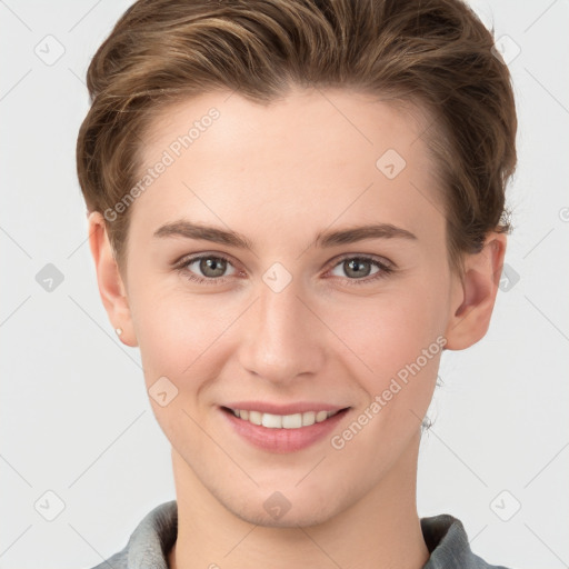 Joyful white young-adult female with short  brown hair and grey eyes