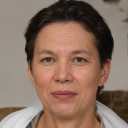 Joyful white adult female with short  brown hair and brown eyes