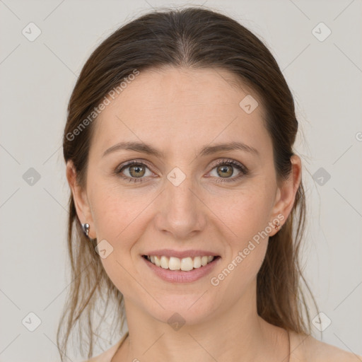 Joyful white young-adult female with medium  brown hair and grey eyes