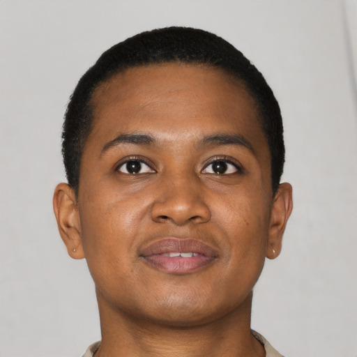 Joyful black young-adult male with short  brown hair and brown eyes