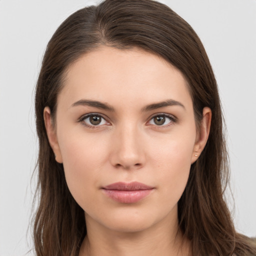 Neutral white young-adult female with long  brown hair and brown eyes