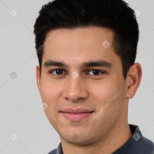 Joyful white young-adult male with short  black hair and brown eyes