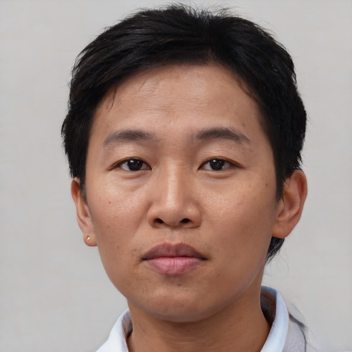 Neutral asian adult male with short  brown hair and brown eyes