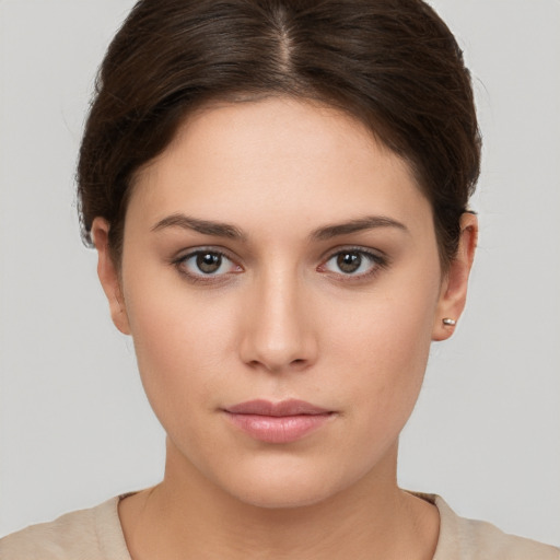 Neutral white young-adult female with short  brown hair and brown eyes