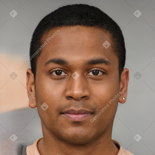 Joyful latino young-adult male with short  brown hair and brown eyes