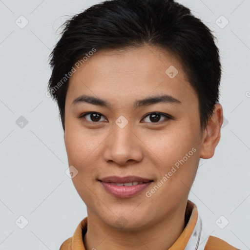 Joyful asian young-adult female with short  brown hair and brown eyes