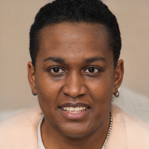 Joyful black young-adult female with short  brown hair and brown eyes