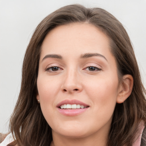 Joyful white young-adult female with long  brown hair and grey eyes